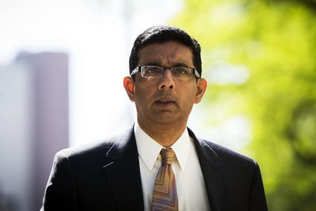 © Reuters. Conservative commentator and best-selling author, Dinesh D'Souza exits the Manhattan Federal Courthouse after pleading guilty in New York