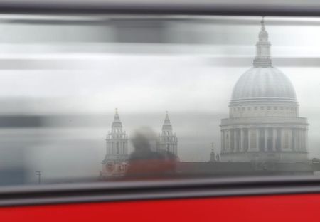 © Reuters. A bus passes St Paul's Cathedral in London