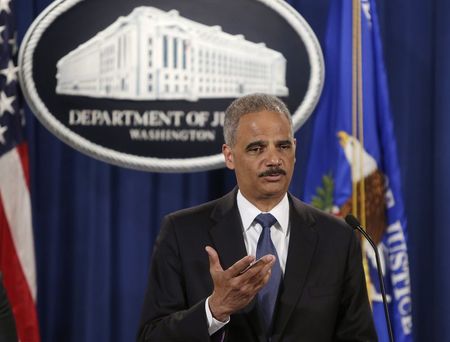 © Reuters. United States Attorney General Holder answers a question at news conference announcing updates on investigation of Brown shooting in Ferguson Missouri, in Washington