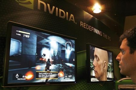 © Reuters. A sells man demonstrates a computer game in a display area of Nvidia Corp. during the second day of the annual 2007 Computex Taipei