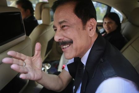 © Reuters. Sahara Group Chairman Roy gestures as he arrives at the Securities and Exchange Board of India headquarters in Mumbai