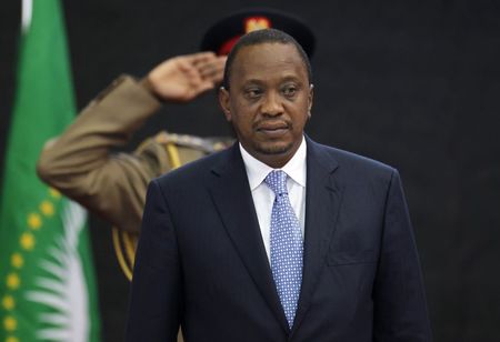 © Reuters. Kenya's President Kenyatta stands for Kenya's national anthem before the Africa Union Peace and Security Council Summit on Terrorism at the Kenyatta International Convention Centre in Nairobi