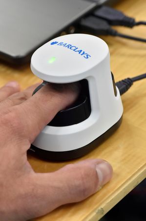 © Reuters. A Barclays biometric reader that scans a finger and identifies unique vein patterns to access bank accounts in an undated photo.