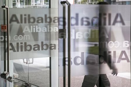 © Reuters. A man walks out of a building at Alibaba's headquarters on the outskirts of Hangzhou