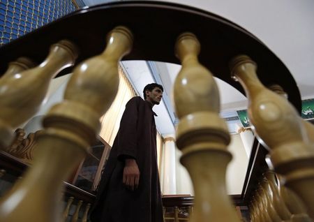 © Reuters. One of seven men convicted of raping and robbing appears at a court in Kabul