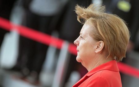 © Reuters. German Chancellor Angela Merkel is seen before reviewing the guard of honour of the German armed forces, the Bundeswehr, at the Chancellery in Berlin