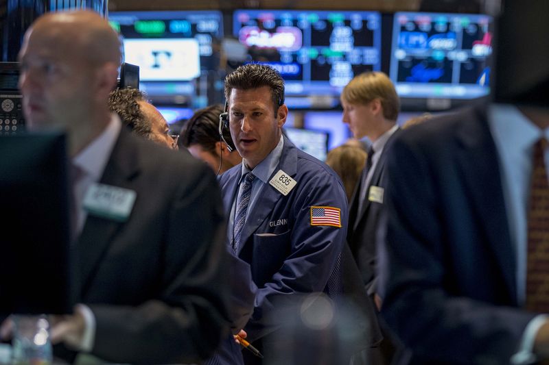 &copy; Reuters Traders work on the floor of the New York Stock Exchange