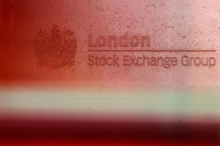 © Reuters. A red London bus passes the Stock Exchange  in London