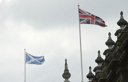 © Reuters. A Union Flag and Scottish Saltire fly over Britain's Cabinet Office in central London