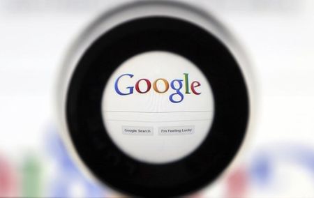 © Reuters. A Google search page is seen through a magnifying glass in this photo illustration taken in Brussels