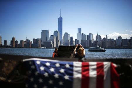 © Reuters. People visit the 9/11 memorial in Exchange Place, New Jersey
