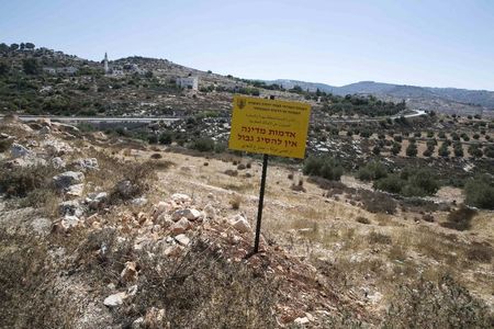 © Reuters. A sign reading "State land, no trespassing" is seen near the Palestinian village of Jab'a, west of Bethlehem