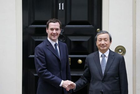 © Reuters. Britain's Chancellor of the Exchequer George Osborne poses with China's Vice Premier Ma Kai outside 11 Downing Street in London