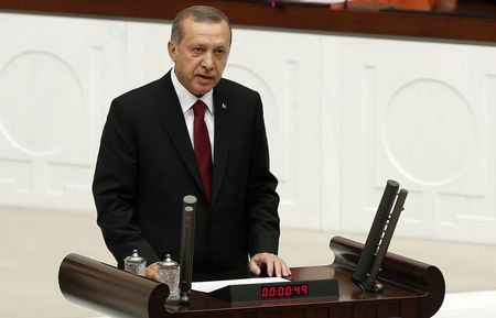 © Reuters. Turkey's new President Erdogan attends a swearing in ceremony at the parliament in Ankara