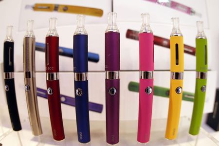 © Reuters. File photo of a window display with different colour models of electronic cigarettes is seen in a shop in Paris