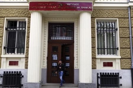 © Reuters. Man walks out of the main office of Bulgaria's Corporate Commercial Bank in Sofia