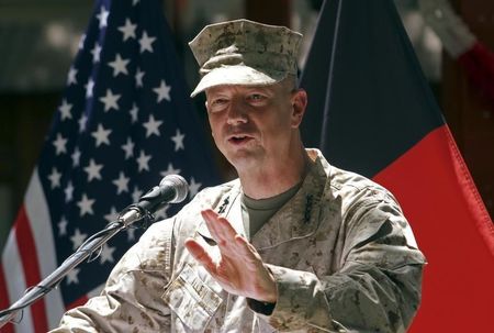 © Reuters. U.S. General John Allen, commander of the NATO forces in Afghanistan, speaks during U.S. Independence Day celebrations in Kabul
