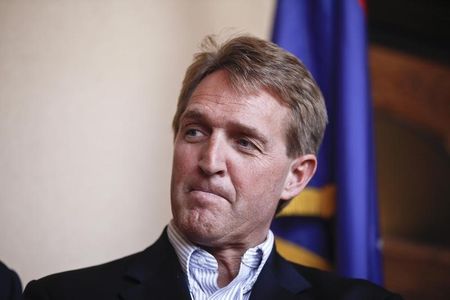 © Reuters. U.S. Senator Flake watches his colleagues speak during a news conference following their tour of the Arizona-Mexico border in Nogales