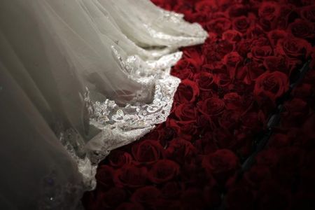 © Reuters. A wedding dress is displayed during a group wedding ceremony hosted by the French Pavilion at the Shanghai World