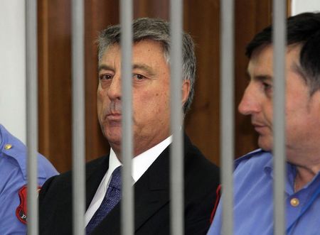 © Reuters. Albania's central bank governor Fullani listens as the charges against him are read out at the court in Tirana