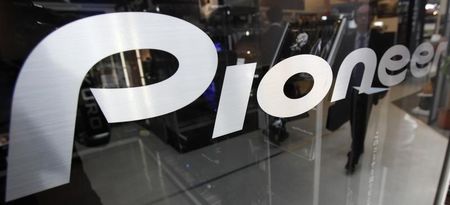 © Reuters. A customer is reflected in a Pioneer Corp sign at an electronics shop in Tokyo