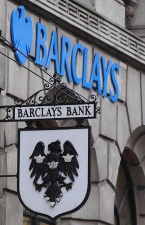 © Reuters. A logo hangs outside a branch of Barclays bank in the City of London