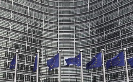 © Reuters. EU flags are seen outside the EU Commission headquarters in Brussels