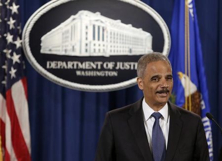 © Reuters. United States Attorney General Eric Holder holds a news conference announcing updates on investigation of Brown shooting in Ferguson Missouri, in Washington