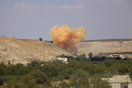 © Reuters. Smoke rises at a site where forces loyal to Syria's President Bashar al-Assad said they have struck, on the outskirts of Zur Abu-Zeid village