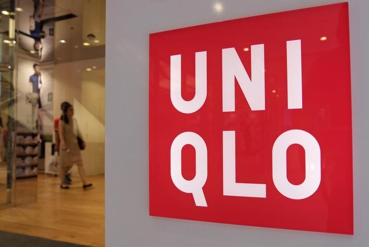 &copy; Reuters Shoppers walk inside Fast Retailing's Uniqlo casual clothing store in Tokyo