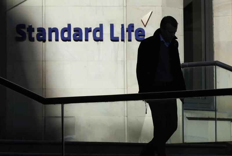 &copy; Reuters A worker leaves the Standard Life House in Edinburgh, Scotland
