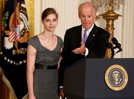 © Reuters. U.S.Vice President Joseph Biden stands next to rape victim Lilly Jay before he introduces President Barack Obama to launch the "It's On Us" campaign to help prevent sexual assault on school campuses while in Washington