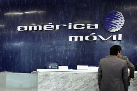 © Reuters. The logo of America Movil is seen on the wall of the reception area in the company's corporate offices in Mexico City