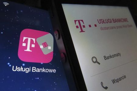 © Reuters. Photo illustration of mobile phone displaying T-mobile banking service app on a tablet screen with same icon