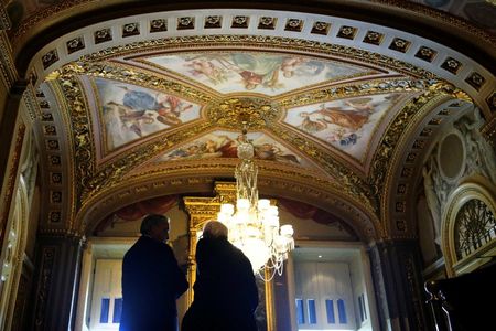 © Reuters. Miller and Sanders talk before holding a news conference to announce bipartisan legislation to address problems in the VA healthcare system, at the U.S. Capitol in Washington