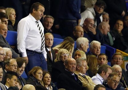 © Reuters. Newcastle United's owner Mike Ashley walks to his seat during their English Premier League soccer match against Everton in Liverpool