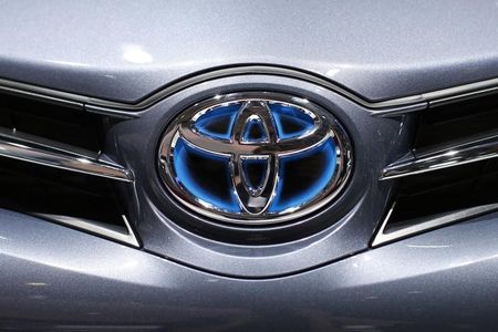 © Reuters. A Toyota logo is seen on a car displayed on media day at the Paris Mondial de l'Automobile