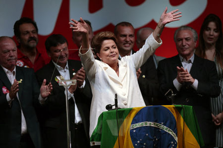 © Reuters. Brazil's President and Workers' Party presidential candidate Rousseff celebrates after the disclosure of election results, in Brasilia