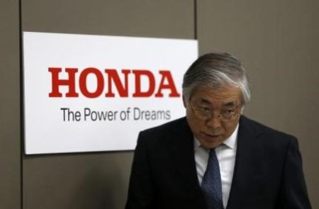 © Reuters. Iwamura, Executive Vice President of Honda Motor Co, walks into a news conference at the company's headquarters in Tokyo