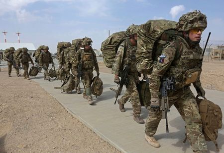 © Reuters. British troops prepare to depart upon the end of operations for U.S. Marines and British combat troops in Helmand