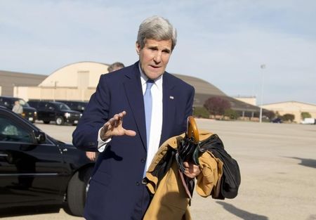 © Reuters. U.S. Secretary of State John Kerry is seen before boarding his plane at Andrews Air Force Base in Maryland