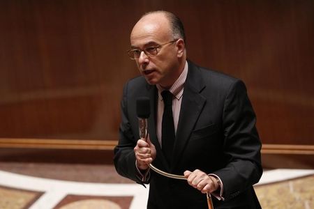 © Reuters. French Interior Minister Bernard Cazeneuve attends the questions to the government session at the National Assembly in Paris