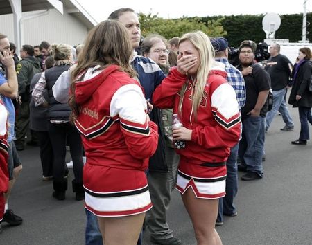 © Reuters. Students and family members reunite at Shoultes Gospel Hall church after an active shooter situation at Marysville-Pilchuck High School in Marysville, Washington