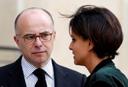 © Reuters. French Interior Minister Bernard Cazeneuve and Education and Research minister Najat Vallaud-Belkacem leave after a meeting on  Ebola at the Elysee Palace in Paris