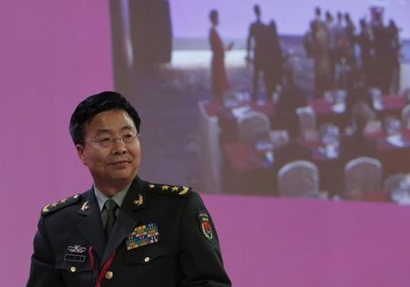 © Reuters. Deputy chief of staff of the Chinese Army Lieutenant-General Wang walks to the rostrum to speak during  The Shangri-La Dialogue in Singapore