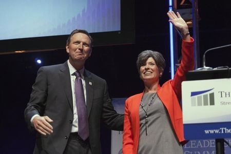 © Reuters. Vander Plaats, president of The Family Leader, greets Iowa Senate candidate Ernst following her speech at the Family Leadership Summit in Ames