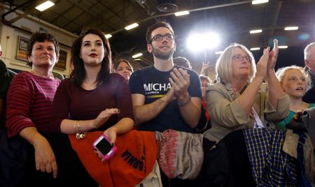 © Reuters. Supporters listen as U.S. President Barack Obama speaks at a campaign event for U.S. Rep. Mike Michaud, who is running for Governor of Maine, in Maine