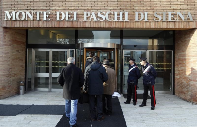 &copy; Reuters People arrive at Banca Monte dei Paschi in Siena