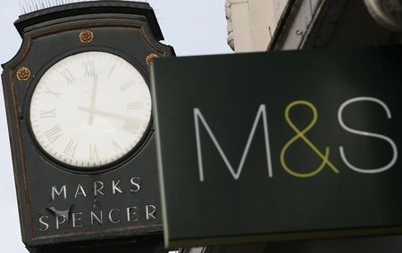 © Reuters. Marks & Spencer signs are seen outside outside a store in London