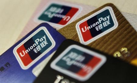 © Reuters. Logos of China UnionPay are seen on bank cards in this photo illustration taken in Beijing